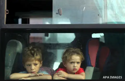 Palestinians wait for travel permits to cross into Egypt at the Rafah border crossing between Egypt and southern Gaza Strip June 23, 2015. Egyptian authorities last week decided to open the Rafah crossing to allow Palest...