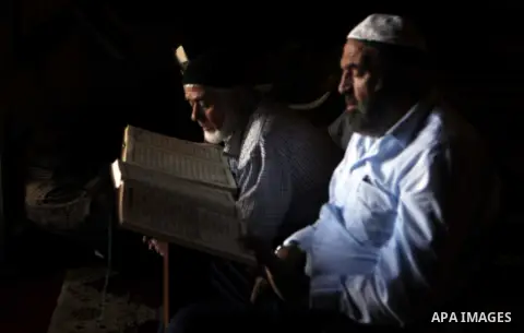 Palestinians read the Koran at the Al-Aqsa Mosque compound during the Muslim holy month of Ramadan, in Jerusalem, on June 23, 2015. Most Muslims around the world have begun observing the holy fasting month of Ramadan, ce...