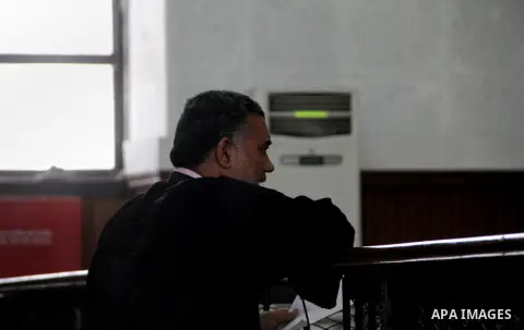 An Egyptian Lawyer speaks to Judge during the trial of Egyptian radical Islamist Mohammed al-Zawahiri, the brother of Al-Qaeda chief Ayman al-Zawahiri with 68 other defendants in Cairo on July 6, 2015. Photo by Amr Sayed