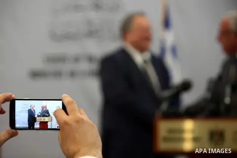 Greek Foreign Minister Nikos Kotzias speaks during a joint press conference with Palestinian Foreign Minister Riyad al-Maliki at the Foreign Affairs ministry in the West Bank city of Ramallah on July 7, 2015. Photo by Sh...