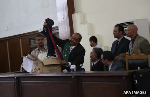 The Judge displays the weapons used by Ansar Bait Al-Maqdis group, during their trial in Cairo on July 15, 2015. 213 Suspects of Ansar Bait Al-Maqdis group, on charges of assassination of police officers, attempted assas...