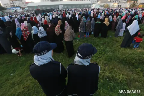 Palestinians attend Eid al-Fitr prayers at al-Saraya Square in Gaza City July 17, 2015. Eid al-Fitr marks the end of the Muslim holy month of Ramadan. Photo by Mohammed Asad
