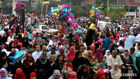 Egyptians celebrate Eid al-Fitr in Cairo, Egypt, on July 17, 2015. Eid al-Fitr marks the end of the Muslim holy month of Ramadan. Photo by Amr Sayed