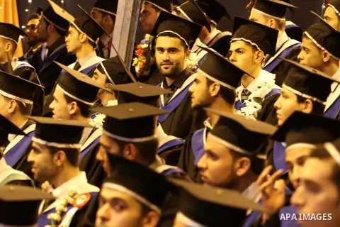 Palestinian students of the University collage of applied science, attend their graduation ceremony, in Gaza city on July 26, 2015. Photo by Mohammed Asad
