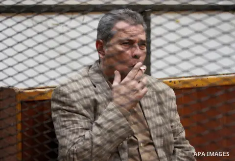 Egyptian television presenter Tawfiq Okasha, attends the trial of Muslim Brotherhood members in a court in Cairo on July 27, 2015. Cairo Criminal court resumes on Monday, the trial of ousted President, Mohamed Morsi alon...