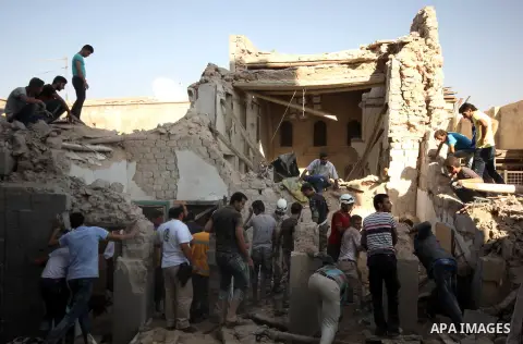 Syrians search for survivors amidst the rubble of a house after a reported missile fired by Syrian government forces hit a residential area in the Jeb Al-Qubbah district in the northern Syrian city of Aleppo on July 27,...