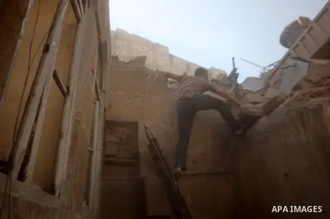 A Syrian man searches for survivors amidst the rubble of a house after a reported missile fired by Syrian government forces hit a residential area in the Jeb Al-Qubbah district in the northern Syrian city of Aleppo on Ju...