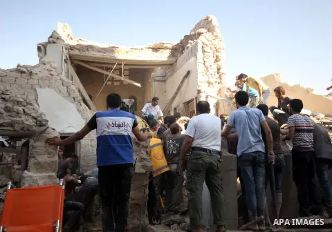Syrians search for survivors amidst the rubble of a house after a reported missile fired by Syrian government forces hit a residential area in the Jeb Al-Qubbah district in the northern Syrian city of Aleppo on July 27,...