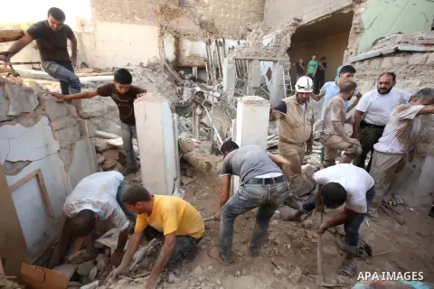 Syrians search for survivors amidst the rubble of a house after a reported missile fired by Syrian government forces hit a residential area in the Jeb Al-Qubbah district in the northern Syrian city of Aleppo on July 27,...