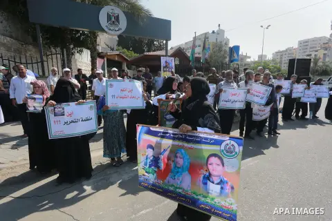 Palestinian families of martyrs take part a protest to demand their rights, in front of the headquarters of the Council of Ministers in Gaza city, on July 28, 2015. Photo by Mohammed Asad