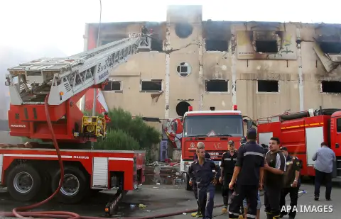Egyptian firemen put out the flames after a fire broke out at the Al-Helw furniture factory north of the capital Cairo killing at least 19 working according to security and health workers on July 28, 2015. Security offic...