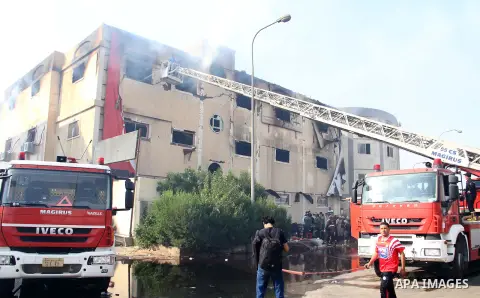 Egyptian firemen put out the flames after a fire broke out at the Al-Helw furniture factory north of the capital Cairo killing at least 19 working according to security and health workers on July 28, 2015. Security offic...