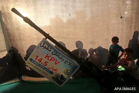 Palestinians watch weapons that used during the Israeli 50-day war on Gaza Strip last summer, during a weapons exhibition in a military-style camp organized by the Hamas movement in Gaza City on July 28, 2015. Hamas's ar...