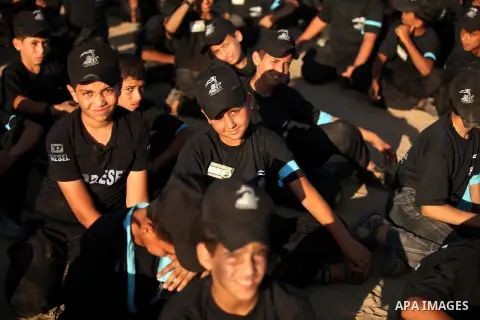 Palestinian youths attend a military-style camp organized by the Hamas movement in Gaza City on July 28, 2015. Hamas's armed wing organized "Liberation Youths Camps" for young Palestinians aged between 15 and 21 to prepa...