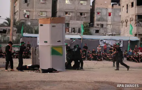 Palestinian youths demonstrate their skills during a military-style camp organized by the Hamas movement in Gaza City on July 28, 2015. Hamas's armed wing organized "Liberation Youths Camps" for young Palestinians aged b...