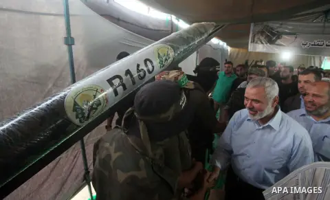 Senior Hamas leader Ismail Haniyeh, attends a weapons exhibition, that used during the Israeli 50-day war on Gaza Strip last summer, in a military-style camp organized by the Hamas movement in Gaza City on July 28, 2015....