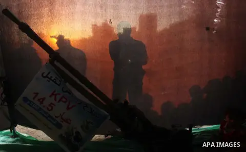 Palestinians watch weapons that used during the Israeli 50-day war on Gaza Strip last summer, during a weapons exhibition in a military-style camp organized by the Hamas movement in Gaza City on July 28, 2015. Hamas's ar...