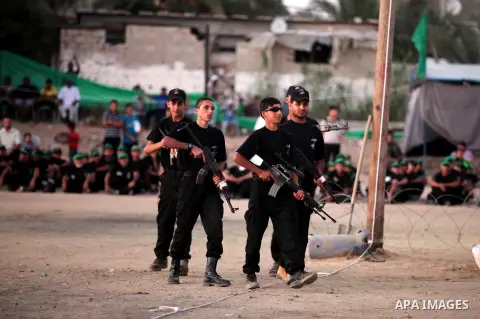 Palestinian youths demonstrate their skills during a military-style camp organized by the Hamas movement in Gaza City on July 28, 2015. Hamas's armed wing organized "Liberation Youths Camps" for young Palestinians aged b...