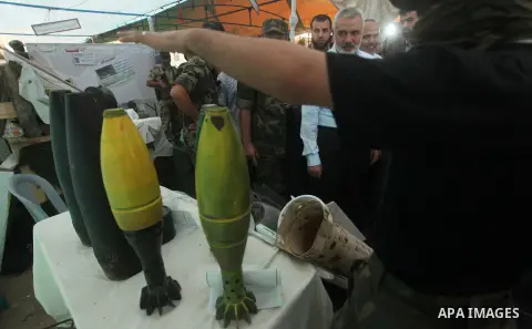 Senior Hamas leader Ismail Haniyeh, attends a weapons exhibition, that used during the Israeli 50-day war on Gaza Strip last summer, in a military-style camp organized by the Hamas movement in Gaza City on July 28, 2015....