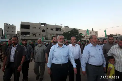 Senior Hamas leader Ismail Haniyeh, attends a weapons exhibition during a military-style camp organized by his movement in Gaza City on July 28, 2015. Hamas's armed wing organized "Liberation Youths Camps" for young Pale...