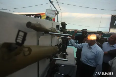 Senior Hamas leader Ismail Haniyeh, attends a weapons exhibition, that used during the Israeli 50-day war on Gaza Strip last summer, in a military-style camp organized by the Hamas movement in Gaza City on July 28, 2015....