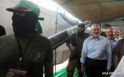 Senior Hamas leader Ismail Haniyeh, attends a weapons exhibition, that used during the Israeli 50-day war on Gaza Strip last summer, in a military-style camp organized by the Hamas movement in Gaza City on July 28, 2015....