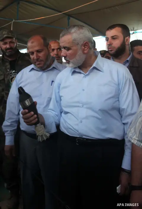 Senior Hamas leader Ismail Haniyeh, attends a weapons exhibition, that used during the Israeli 50-day war on Gaza Strip last summer, in a military-style camp organized by the Hamas movement in Gaza City on July 28, 2015....