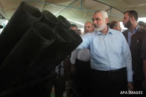 Senior Hamas leader Ismail Haniyeh, attends a weapons exhibition, that used during the Israeli 50-day war on Gaza Strip last summer, in a military-style camp organized by the Hamas movement in Gaza City on July 28, 2015....