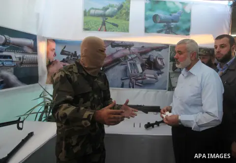 Senior Hamas leader Ismail Haniyeh, attends a weapons exhibition, that used during the Israeli 50-day war on Gaza Strip last summer, in a military-style camp organized by the Hamas movement in Gaza City on July 28, 2015....