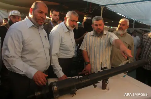 Senior Hamas leader Ismail Haniyeh, attends a weapons exhibition, that used during the Israeli 50-day war on Gaza Strip last summer, in a military-style camp organized by the Hamas movement in Gaza City on July 28, 2015....