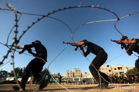 Palestinian youths demonstrate their skills during a military-style camp organized by the Hamas movement in Gaza City on July 28, 2015. Hamas's armed wing organized "Liberation Youths Camps" for young Palestinians aged b...