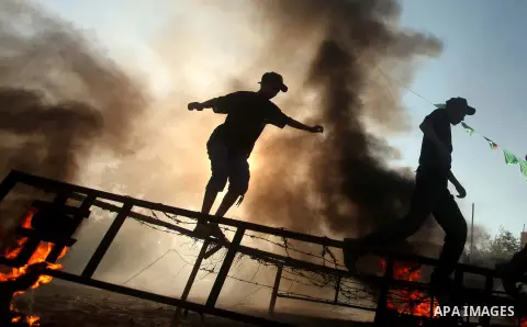 Palestinian youths demonstrate their skills during a military-style camp organized by the Hamas movement in Gaza City on July 28, 2015. Hamas's armed wing organized "Liberation Youths Camps" for young Palestinians aged b...