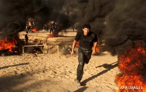 Palestinian youths demonstrate their skills during a military-style camp organized by the Hamas movement in Gaza City on July 28, 2015. Hamas's armed wing organized "Liberation Youths Camps" for young Palestinians aged b...