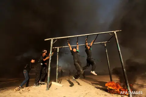 Palestinian youths demonstrate their skills during a military-style camp organized by the Hamas movement in Gaza City on July 28, 2015. Hamas's armed wing organized "Liberation Youths Camps" for young Palestinians aged b...