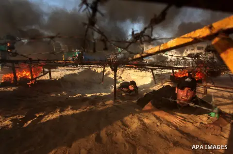 Palestinian youths demonstrate their skills during a military-style camp organized by the Hamas movement in Gaza City on July 28, 2015. Hamas's armed wing organized "Liberation Youths Camps" for young Palestinians aged b...