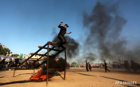 Palestinian youths demonstrate their skills during a military-style camp organized by the Hamas movement in Gaza City on July 28, 2015. Hamas's armed wing organized "Liberation Youths Camps" for young Palestinians aged b...