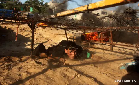Palestinian youths demonstrate their skills during a military-style camp organized by the Hamas movement in Gaza City on July 28, 2015. Hamas's armed wing organized "Liberation Youths Camps" for young Palestinians aged b...