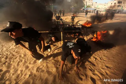 Palestinian youths demonstrate their skills during a military-style camp organized by the Hamas movement in Gaza City on July 28, 2015. Hamas's armed wing organized "Liberation Youths Camps" for young Palestinians aged b...