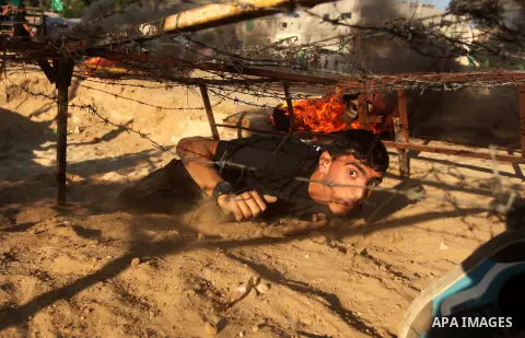 Palestinian youths demonstrate their skills during a military-style camp organized by the Hamas movement in Gaza City on July 28, 2015. Hamas's armed wing organized "Liberation Youths Camps" for young Palestinians aged b...