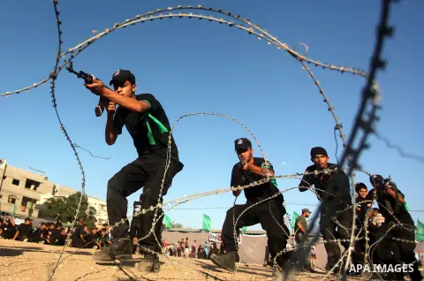 Palestinian youths demonstrate their skills during a military-style camp organized by the Hamas movement in Gaza City on July 28, 2015. Hamas's armed wing organized "Liberation Youths Camps" for young Palestinians aged b...