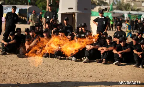 Palestinian youths demonstrate their skills during a military-style camp organized by the Hamas movement in Gaza City on July 28, 2015. Hamas's armed wing organized "Liberation Youths Camps" for young Palestinians aged b...