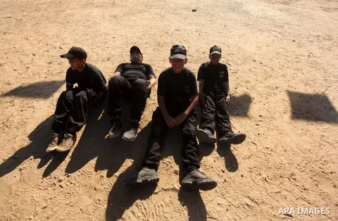 Palestinian youths demonstrate their skills during a military-style camp organized by the Hamas movement in Gaza City on July 28, 2015. Hamas's armed wing organized "Liberation Youths Camps" for young Palestinians aged b...