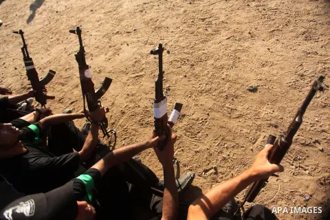 Palestinian youths take part in a military-style camp organized by the Hamas movement in Gaza City on July 28, 2015. Hamas's armed wing organized "Liberation Youths Camps" for young Palestinians aged between 15 and 21 to...
