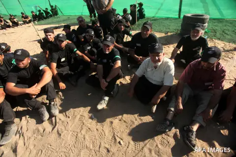 Palestinians take part in a military-style camp organized by the Hamas movement in Gaza City on July 28, 2015. Hamas's armed wing organized "Liberation Youths Camps" for young Palestinians aged between 15 and 21 to prepa...