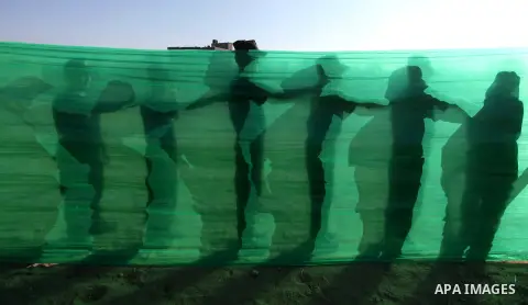 Palestinian youths demonstrate their skills during a military-style camp organized by the Hamas movement in Gaza City on July 28, 2015. Hamas's armed wing organized "Liberation Youths Camps" for young Palestinians aged b...