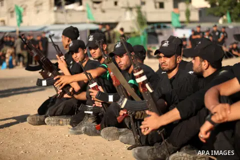 Palestinian youths demonstrate their skills during a military-style camp organized by the Hamas movement in Gaza City on July 28, 2015. Hamas's armed wing organized "Liberation Youths Camps" for young Palestinians aged b...