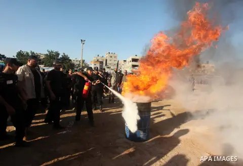 Palestinian youths demonstrate their skills during a military-style camp organized by the Hamas movement in Gaza City on July 28, 2015. Hamas's armed wing organized "Liberation Youths Camps" for young Palestinians aged b...