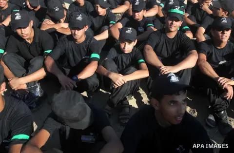 Palestinian youths demonstrate their skills during a military-style camp organized by the Hamas movement in Gaza City on July 28, 2015. Hamas's armed wing organized "Liberation Youths Camps" for young Palestinians aged b...