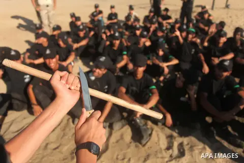 Palestinian youths demonstrate their skills during a military-style camp organized by the Hamas movement in Gaza City on July 28, 2015. Hamas's armed wing organized "Liberation Youths Camps" for young Palestinians aged b...