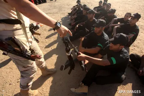 Palestinian youths take part in a military-style camp organized by the Hamas movement in Gaza City on July 28, 2015. Hamas's armed wing organized "Liberation Youths Camps" for young Palestinians aged between 15 and 21 to...
